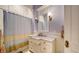 Charming bathroom with a marble countertop and updated fixtures at 5309 Hidden Harbor Rd, Sarasota, FL 34242