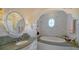 Elegant bathroom with granite vanity, oval soaking tub, and decorative tile at 5309 Hidden Harbor Rd, Sarasota, FL 34242
