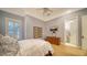 Serene bedroom with ensuite bathroom access and a mounted TV at 5309 Hidden Harbor Rd, Sarasota, FL 34242