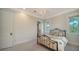 Light and airy bedroom with iron bed frame and ample closet space at 5309 Hidden Harbor Rd, Sarasota, FL 34242