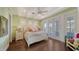 Bright bedroom with white bed, soft colors, and access to private balcony at 5309 Hidden Harbor Rd, Sarasota, FL 34242