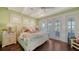 Bedroom with white bed, soft color scheme, and access to private balcony at 5309 Hidden Harbor Rd, Sarasota, FL 34242