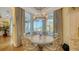 Charming breakfast nook with bay window and a round table at 5309 Hidden Harbor Rd, Sarasota, FL 34242