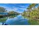 Serene canal views with private docks and lush tropical landscaping at 5309 Hidden Harbor Rd, Sarasota, FL 34242