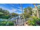 Private dock and canal access with lush landscaping and tropical foliage at 5309 Hidden Harbor Rd, Sarasota, FL 34242