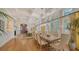 Spacious dining room with hardwood floors and lots of natural light at 5309 Hidden Harbor Rd, Sarasota, FL 34242