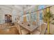 Bright dining room with hardwood floors and large windows at 5309 Hidden Harbor Rd, Sarasota, FL 34242