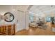 Bright entryway with hardwood floors, a console table, and a view into the living room at 5309 Hidden Harbor Rd, Sarasota, FL 34242
