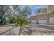 Landscaped grounds showcasing a brick driveway and a portion of the house's exterior at 5309 Hidden Harbor Rd, Sarasota, FL 34242