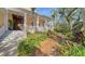 Inviting front entrance with stairs, porch, and well-maintained landscaping at 5309 Hidden Harbor Rd, Sarasota, FL 34242