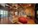 Spacious game room boasts a large sectional sofa, a beanbag chair, and wood paneled walls at 5309 Hidden Harbor Rd, Sarasota, FL 34242