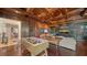 Entertainment game room with foosball table and large screen TV at 5309 Hidden Harbor Rd, Sarasota, FL 34242