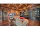 Game room with large sectional sofa, media center, and built-in shelving at 5309 Hidden Harbor Rd, Sarasota, FL 34242