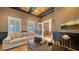 Bright home office features a comfortable sitting area and hardwood floors at 5309 Hidden Harbor Rd, Sarasota, FL 34242