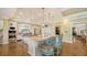 Gourmet kitchen with island, granite counters, and custom cabinetry at 5309 Hidden Harbor Rd, Sarasota, FL 34242