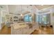 Open kitchen with island, granite counters, and breakfast bar at 5309 Hidden Harbor Rd, Sarasota, FL 34242