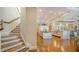 Island kitchen with hardwood floors and white cabinetry at 5309 Hidden Harbor Rd, Sarasota, FL 34242