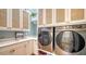 Modern laundry room with stackable washer and dryer at 5309 Hidden Harbor Rd, Sarasota, FL 34242