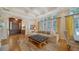 Bright living room with hardwood floors, large windows, and comfy seating at 5309 Hidden Harbor Rd, Sarasota, FL 34242
