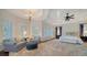 Spacious main bedroom with sitting area, plush carpet, and large windows at 5309 Hidden Harbor Rd, Sarasota, FL 34242