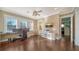 Home office with built in shelving, hardwood floors, and plenty of natural light at 5309 Hidden Harbor Rd, Sarasota, FL 34242