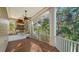 Covered outdoor kitchen with stainless steel appliances and granite counters at 5309 Hidden Harbor Rd, Sarasota, FL 34242