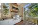 Luxury outdoor kitchen featuring stainless steel grill and granite countertops at 5309 Hidden Harbor Rd, Sarasota, FL 34242