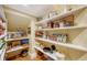 Well-organized pantry with ample shelving for storage at 5309 Hidden Harbor Rd, Sarasota, FL 34242