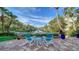 Relaxing patio with waterfront views and two Adirondack chairs at 5309 Hidden Harbor Rd, Sarasota, FL 34242