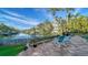 Enjoy waterfront views from this relaxing patio with two Adirondack chairs at 5309 Hidden Harbor Rd, Sarasota, FL 34242
