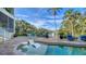 Relaxing pool and spa area with patio furniture and tranquil water views at 5309 Hidden Harbor Rd, Sarasota, FL 34242