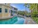 Expansive pool and patio area, steps from the house with multiple lounge chairs at 5309 Hidden Harbor Rd, Sarasota, FL 34242