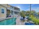 Stunning pool and patio area with multiple lounge chairs and access to the house at 5309 Hidden Harbor Rd, Sarasota, FL 34242