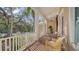 Spacious porch with white railings offering views of the surrounding landscape at 5309 Hidden Harbor Rd, Sarasota, FL 34242
