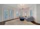 Bright sitting room with French doors and comfy seating at 5309 Hidden Harbor Rd, Sarasota, FL 34242