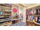 Spacious walk-in closet with custom shelving and storage at 5309 Hidden Harbor Rd, Sarasota, FL 34242