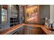 Wet bar with dark cabinetry and granite countertop at 5309 Hidden Harbor Rd, Sarasota, FL 34242