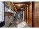 Unfinished basement with exposed beams, ladder, and storage at 258 Seminole Nw Blvd, Port Charlotte, FL 33952