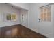 Bright dining room with wood-look tile floor and view to backyard at 258 Seminole Nw Blvd, Port Charlotte, FL 33952