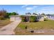 Ranch-style home with carport and fenced yard at 258 Seminole Nw Blvd, Port Charlotte, FL 33952