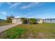 Ranch style home with mature landscaping and driveway at 258 Seminole Nw Blvd, Port Charlotte, FL 33952
