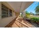 Screened porch with paver tile floor and view of yard at 258 Seminole Nw Blvd, Port Charlotte, FL 33952