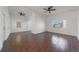 Open living room with tile floors and ceiling fan at 258 Seminole Nw Blvd, Port Charlotte, FL 33952