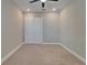 Spacious bedroom with carpet and double door closet at 4564 Almada Ln, Wesley Chapel, FL 33543