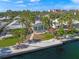 Aerial view of a waterfront home with lush landscaping at 1358 Moonmist Dr # B4, Sarasota, FL 34242