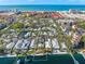 An aerial view of a waterfront home amongst other houses at 1358 Moonmist Dr # B4, Sarasota, FL 34242