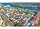 Aerial view showcasing a waterfront community of homes and lush landscaping at 1358 Moonmist Dr # B4, Sarasota, FL 34242