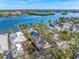 Aerial view of a single Gathering home with mature landscaping and waterfront access at 1358 Moonmist Dr # B4, Sarasota, FL 34242