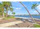 Spacious backyard with water views and palm trees at 1358 Moonmist Dr # B4, Sarasota, FL 34242
