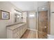 Bathroom with granite vanity and glass enclosed shower at 1358 Moonmist Dr # B4, Sarasota, FL 34242
